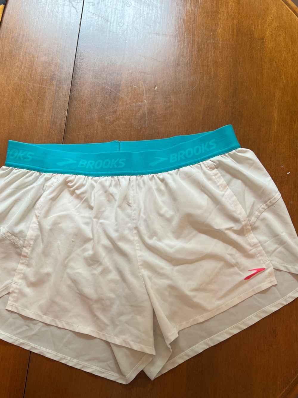 Brooks Women’s White Running Shorts with Teal Waistband and Pink Logo